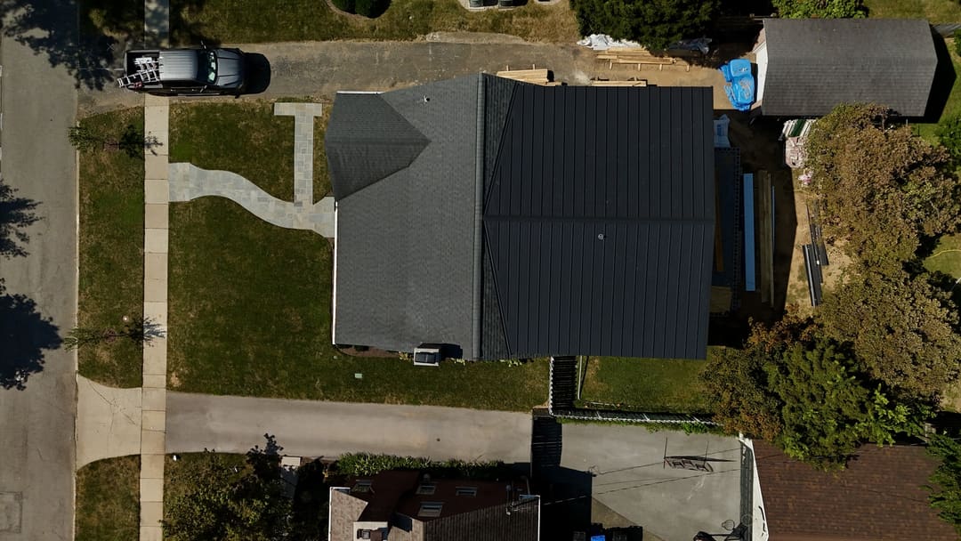 A black metal roof seen straight down from the drone