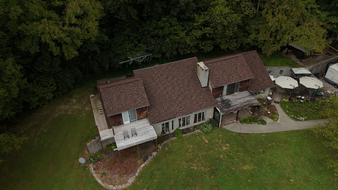 Brown shingle roof on a cedar home from a high corner angle