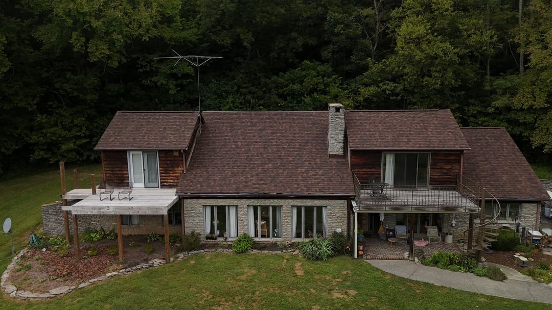 Wide view of the cedar home roof and its back decks
