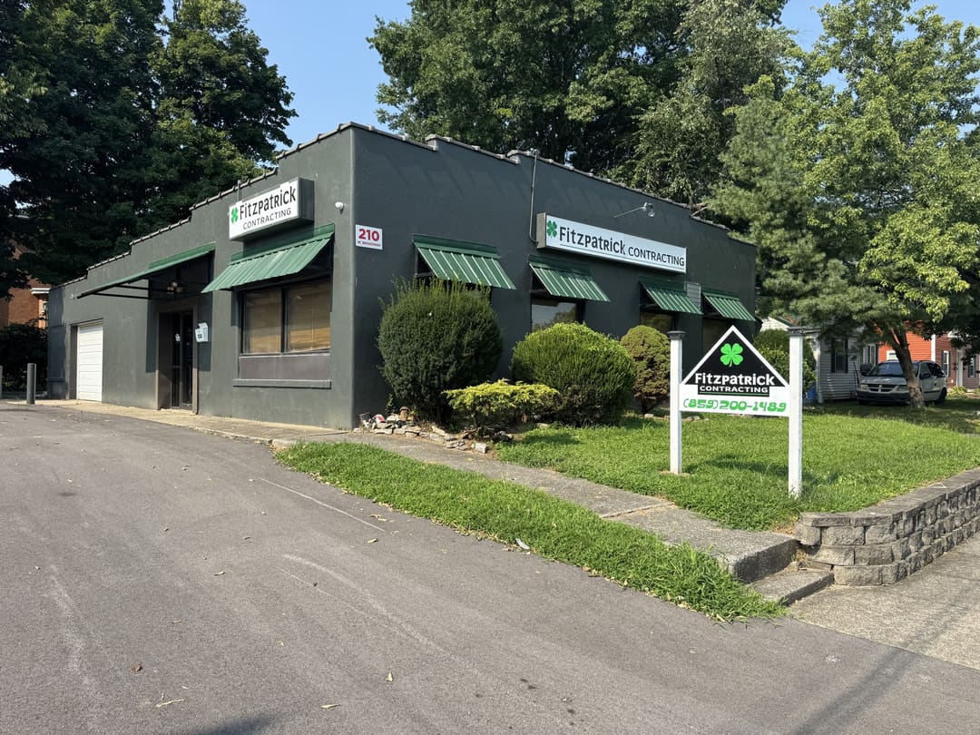 The Fitzpatrick Contracting office on Broadway in Richmond, a dark green building with green awnings and the company sign
