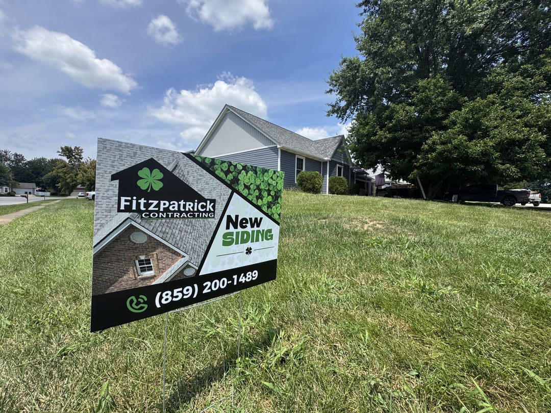 Fitzpatrick Contracting New Siding sign on a lawn in a neighborhood