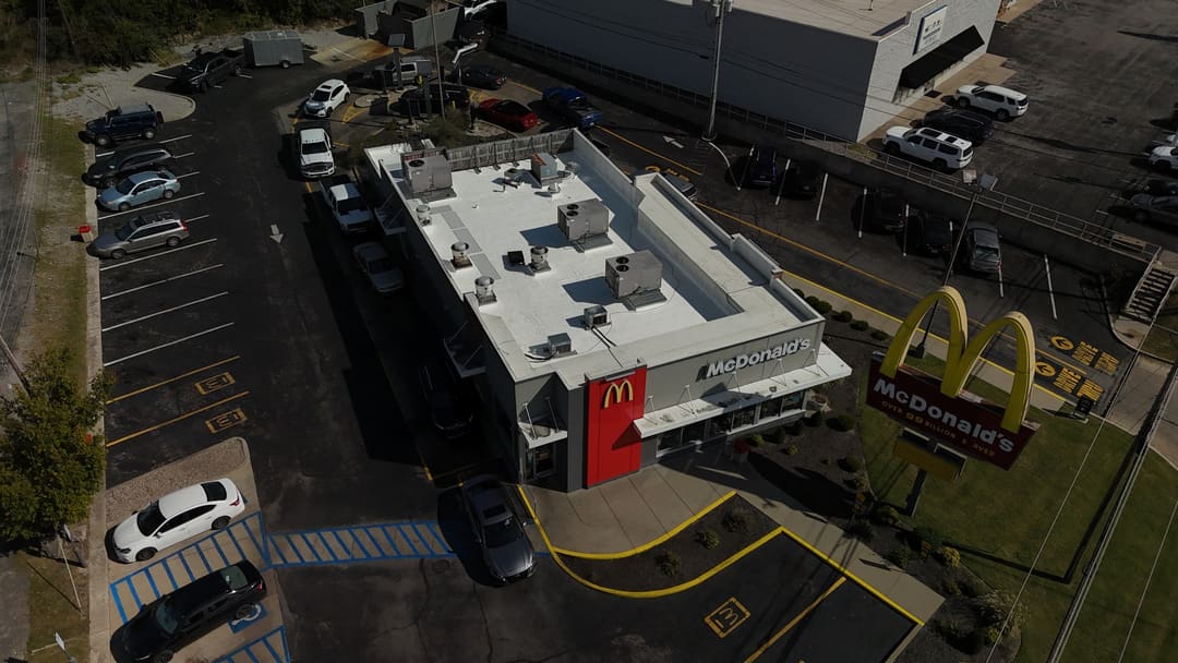 Restaurant membrane roof above its parking lot and drive through